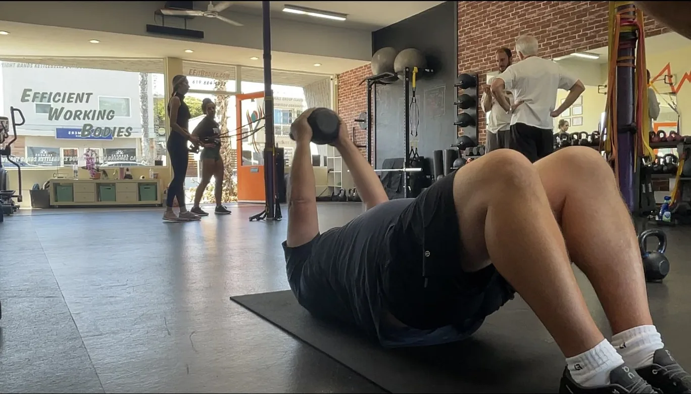 Clients training on the floor at Efficient Working Bodies